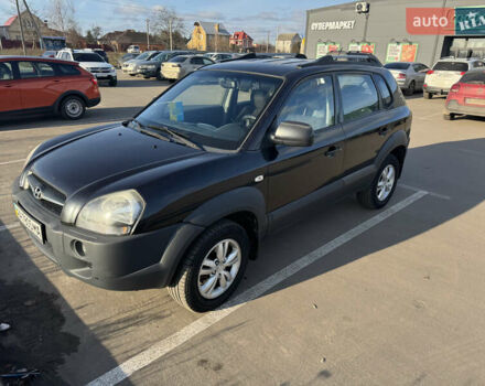 Черный Хендай Туксон, объемом двигателя 1.98 л и пробегом 218 тыс. км за 9350 $, фото 1 на Automoto.ua