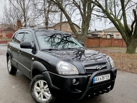 Черный Хендай Туксон, объемом двигателя 2 л и пробегом 160 тыс. км за 9600 $, фото 1 на Automoto.ua