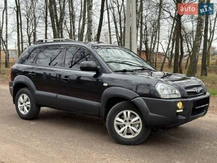 Черный Хендай Туксон, объемом двигателя 1.98 л и пробегом 125 тыс. км за 9850 $, фото 1 на Automoto.ua
