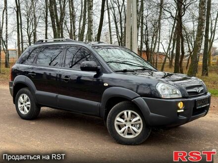 Черный Хендай Туксон, объемом двигателя 2 л и пробегом 125 тыс. км за 9850 $, фото 1 на Automoto.ua