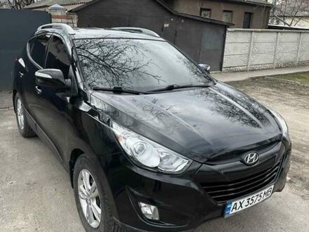 Черный Хендай Туксон, объемом двигателя 2.4 л и пробегом 132 тыс. км за 12900 $, фото 1 на Automoto.ua