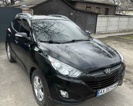 Черный Хендай Туксон, объемом двигателя 2.4 л и пробегом 132 тыс. км за 12900 $, фото 1 на Automoto.ua
