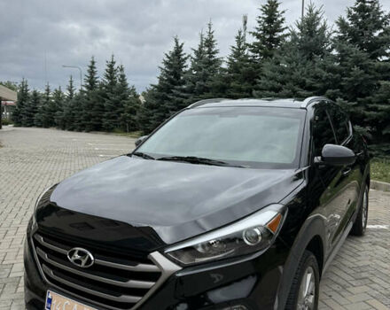 Черный Хендай Туксон, объемом двигателя 2 л и пробегом 105 тыс. км за 15500 $, фото 1 на Automoto.ua