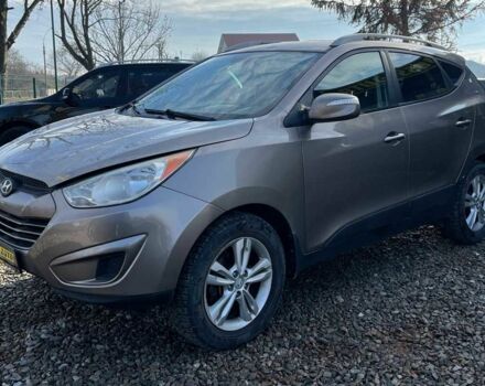 Коричневый Хендай Туксон, объемом двигателя 2.4 л и пробегом 170 тыс. км за 10700 $, фото 3 на Automoto.ua