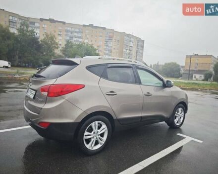 Коричневый Хендай Туксон, объемом двигателя 2.4 л и пробегом 148 тыс. км за 11700 $, фото 10 на Automoto.ua