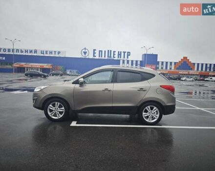 Коричневый Хендай Туксон, объемом двигателя 2.4 л и пробегом 148 тыс. км за 11700 $, фото 5 на Automoto.ua