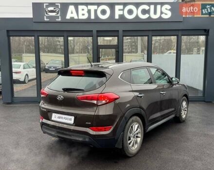 Коричневый Хендай Туксон, объемом двигателя 2 л и пробегом 115 тыс. км за 20990 $, фото 4 на Automoto.ua