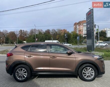 Коричневый Хендай Туксон, объемом двигателя 2 л и пробегом 115 тыс. км за 14200 $, фото 8 на Automoto.ua