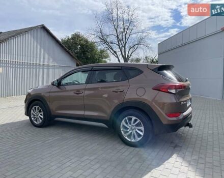 Коричневый Хендай Туксон, объемом двигателя 2 л и пробегом 115 тыс. км за 14200 $, фото 4 на Automoto.ua