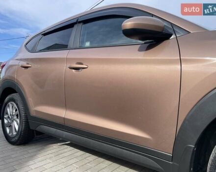 Коричневый Хендай Туксон, объемом двигателя 2 л и пробегом 115 тыс. км за 14200 $, фото 21 на Automoto.ua