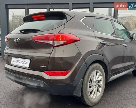 Коричневый Хендай Туксон, объемом двигателя 2 л и пробегом 115 тыс. км за 20990 $, фото 5 на Automoto.ua