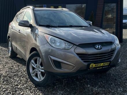 Коричневый Хендай Туксон, объемом двигателя 2.4 л и пробегом 170 тыс. км за 10700 $, фото 1 на Automoto.ua