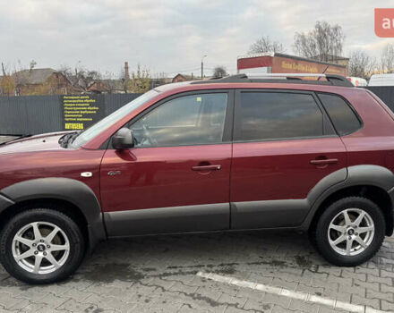 Красный Хендай Туксон, объемом двигателя 2 л и пробегом 255 тыс. км за 6999 $, фото 5 на Automoto.ua