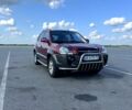 Красный Хендай Туксон, объемом двигателя 2 л и пробегом 143 тыс. км за 10000 $, фото 1 на Automoto.ua