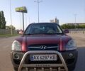 Червоний Хендай Туксон, об'ємом двигуна 1.98 л та пробігом 251 тис. км за 8500 $, фото 1 на Automoto.ua
