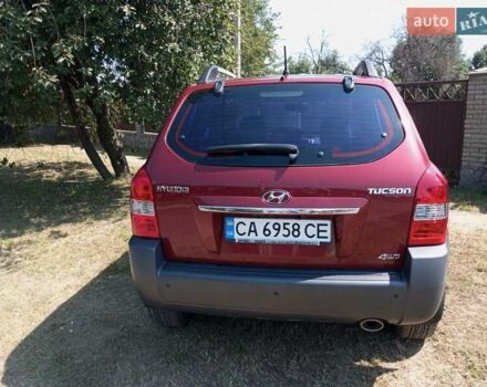 Красный Хендай Туксон, объемом двигателя 1.98 л и пробегом 138 тыс. км за 8899 $, фото 8 на Automoto.ua