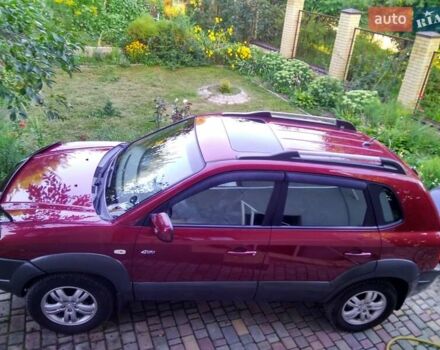 Красный Хендай Туксон, объемом двигателя 1.98 л и пробегом 231 тыс. км за 8500 $, фото 5 на Automoto.ua