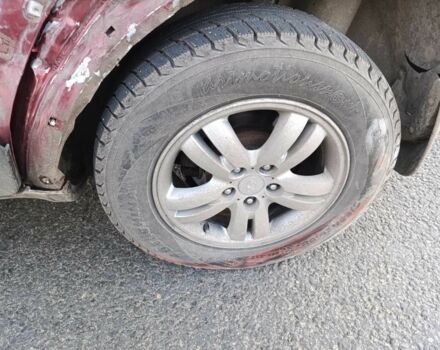 Красный Хендай Туксон, объемом двигателя 2 л и пробегом 170 тыс. км за 4000 $, фото 2 на Automoto.ua