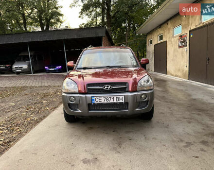 Красный Хендай Туксон, объемом двигателя 1.99 л и пробегом 145 тыс. км за 7999 $, фото 4 на Automoto.ua