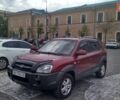 Красный Хендай Туксон, объемом двигателя 1.98 л и пробегом 231 тыс. км за 8500 $, фото 1 на Automoto.ua