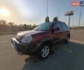 Червоний Хендай Туксон, об'ємом двигуна 1.98 л та пробігом 251 тис. км за 8500 $, фото 1 на Automoto.ua
