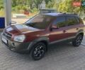 Червоний Хендай Туксон, об'ємом двигуна 1.99 л та пробігом 246 тис. км за 8200 $, фото 1 на Automoto.ua