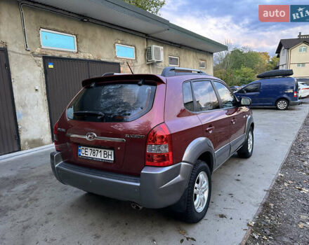 Красный Хендай Туксон, объемом двигателя 1.99 л и пробегом 145 тыс. км за 7999 $, фото 11 на Automoto.ua