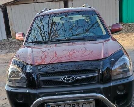 Красный Хендай Туксон, объемом двигателя 1.98 л и пробегом 170 тыс. км за 10500 $, фото 1 на Automoto.ua