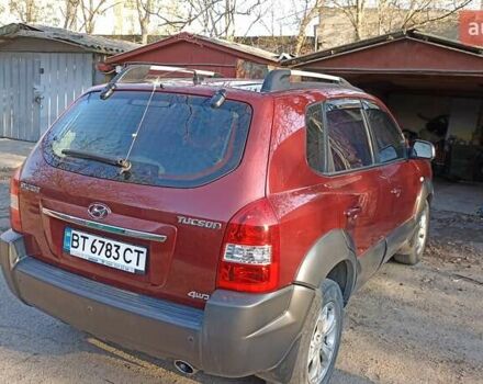 Красный Хендай Туксон, объемом двигателя 1.98 л и пробегом 170 тыс. км за 10500 $, фото 3 на Automoto.ua