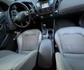 Червоний Хендай Туксон, об'ємом двигуна 2.4 л та пробігом 187 тис. км за 11500 $, фото 3 на Automoto.ua
