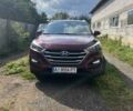 Красный Хендай Туксон, объемом двигателя 2 л и пробегом 101 тыс. км за 15700 $, фото 1 на Automoto.ua