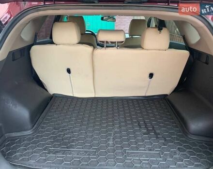 Красный Хендай Туксон, объемом двигателя 2 л и пробегом 123 тыс. км за 15300 $, фото 14 на Automoto.ua