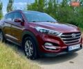 Красный Хендай Туксон, объемом двигателя 2 л и пробегом 228 тыс. км за 18000 $, фото 1 на Automoto.ua