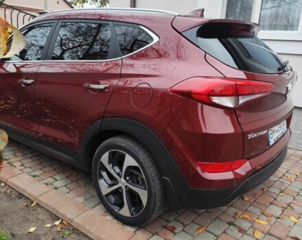 Червоний Хендай Туксон, об'ємом двигуна 2 л та пробігом 110 тис. км за 19800 $, фото 5 на Automoto.ua