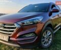 Красный Хендай Туксон, объемом двигателя 2 л и пробегом 133 тыс. км за 17900 $, фото 1 на Automoto.ua