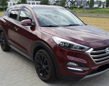 Красный Хендай Туксон, объемом двигателя 2 л и пробегом 34 тыс. км за 10000 $, фото 2 на Automoto.ua