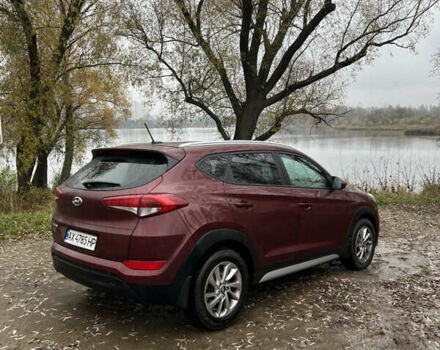 Червоний Хендай Туксон, об'ємом двигуна 2 л та пробігом 150 тис. км за 13300 $, фото 4 на Automoto.ua