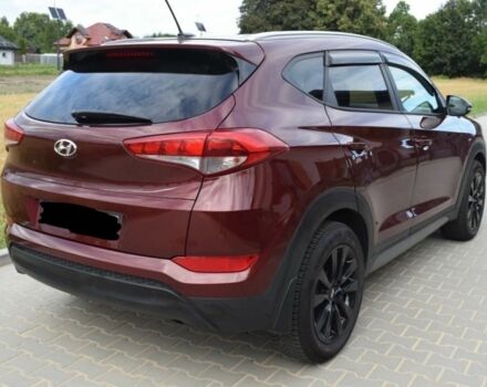 Красный Хендай Туксон, объемом двигателя 2 л и пробегом 34 тыс. км за 10000 $, фото 3 на Automoto.ua