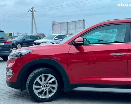 Червоний Хендай Туксон, об'ємом двигуна 2 л та пробігом 136 тис. км за 18690 $, фото 2 на Automoto.ua