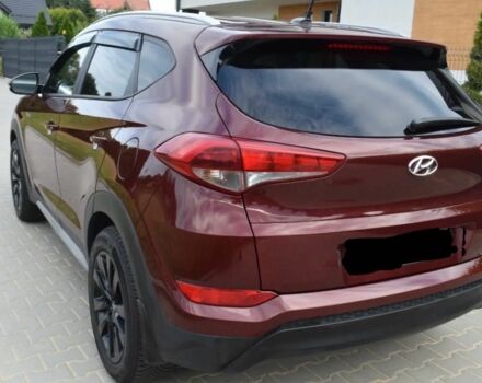 Красный Хендай Туксон, объемом двигателя 2 л и пробегом 34 тыс. км за 10000 $, фото 5 на Automoto.ua