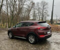 Червоний Хендай Туксон, об'ємом двигуна 2 л та пробігом 150 тис. км за 13300 $, фото 2 на Automoto.ua