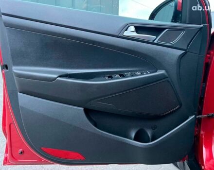 Червоний Хендай Туксон, об'ємом двигуна 2 л та пробігом 136 тис. км за 18690 $, фото 14 на Automoto.ua