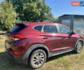 Красный Хендай Туксон, объемом двигателя 2 л и пробегом 72 тыс. км за 14500 $, фото 3 на Automoto.ua