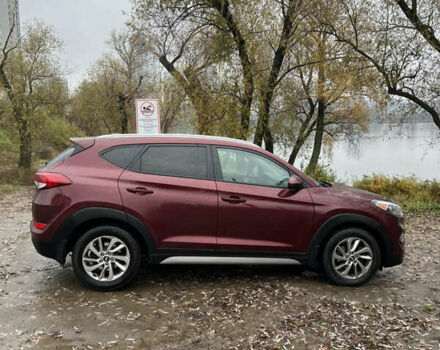 Червоний Хендай Туксон, об'ємом двигуна 2 л та пробігом 150 тис. км за 13300 $, фото 5 на Automoto.ua