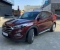 Красный Хендай Туксон, объемом двигателя 2 л и пробегом 117 тыс. км за 17850 $, фото 1 на Automoto.ua