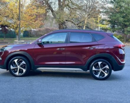 Красный Хендай Туксон, объемом двигателя 1.6 л и пробегом 37 тыс. км за 11550 $, фото 7 на Automoto.ua