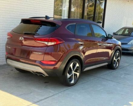 Красный Хендай Туксон, объемом двигателя 1.6 л и пробегом 39 тыс. км за 4800 $, фото 6 на Automoto.ua