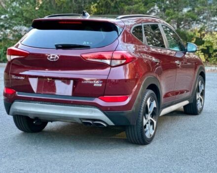 Красный Хендай Туксон, объемом двигателя 1.6 л и пробегом 37 тыс. км за 11550 $, фото 4 на Automoto.ua