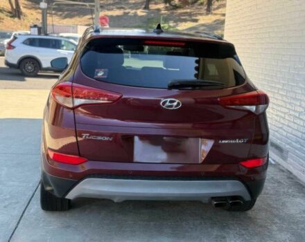 Красный Хендай Туксон, объемом двигателя 1.6 л и пробегом 39 тыс. км за 4800 $, фото 5 на Automoto.ua