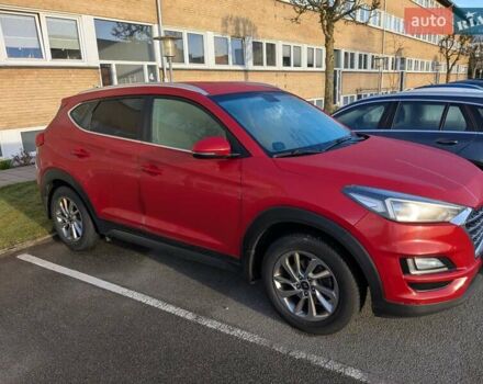 Красный Хендай Туксон, объемом двигателя 2 л и пробегом 157 тыс. км за 20000 $, фото 2 на Automoto.ua